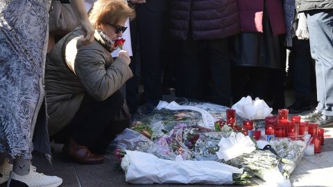 Relatives and friends of the victim observe a minute of silence on January 26, 2023, near the church of Our Lady of Palma in southern Spain, where a sacristan was killed the day before.