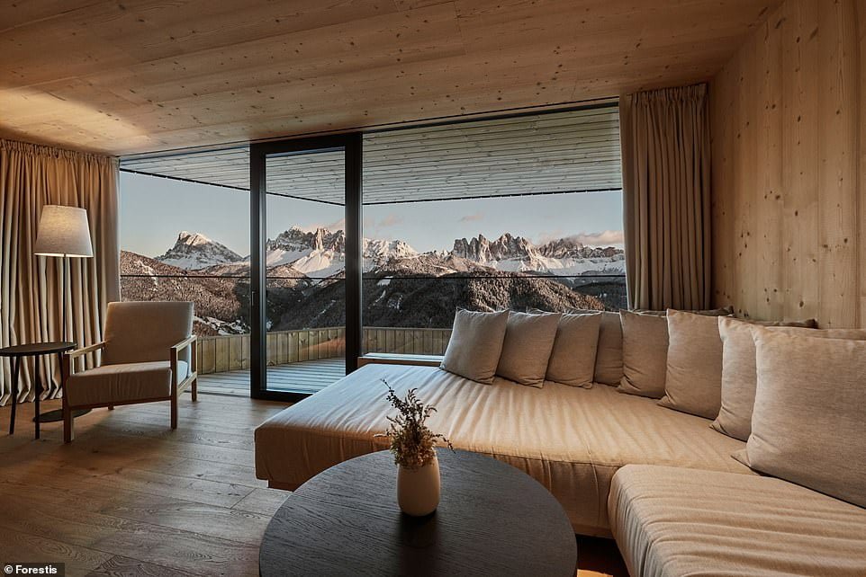 Natural highs: Harriet Sime checks into the Forestis hotel in the Italian ski resort of Plose. Above is the view of the Dolomites from one of the hotel's suites