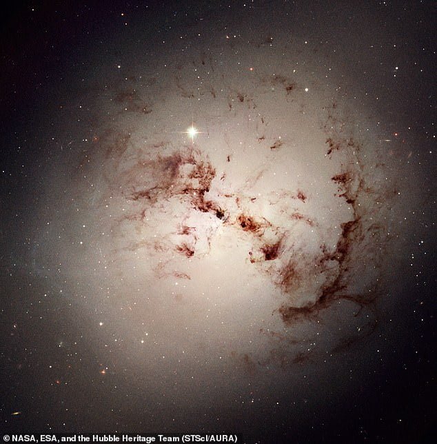 Breakthrough: Scientists have found the first evidence that black holes are the source of dark energy. They studied galaxies and the supermassive black holes at the heart of them. Pictured is NGC 1316, a lenticular galaxy about 60 million light-years away in the constellation Fornax