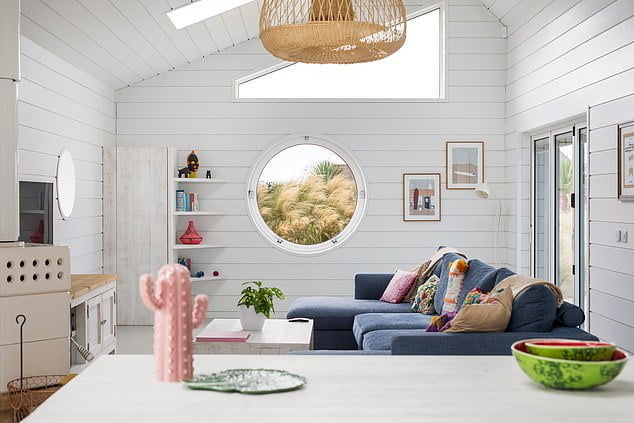 Hugo Brown tries out a three-day wellness package during his stay in one of the pastel-coloured cottages run by Three Mile Beach in Cornwall (pictured)