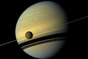 Titan and Saturn as captured by NASA's Cassini spacecraft