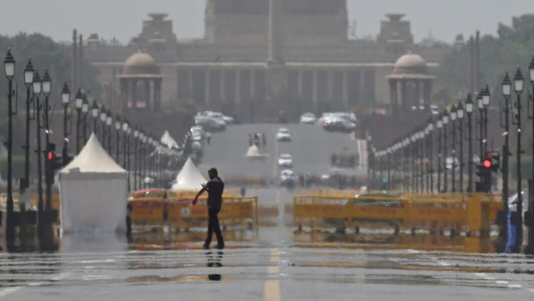 A mirage forms on Kartavya Path due to the scorching heat, on April 18, in New Delhi, India. 