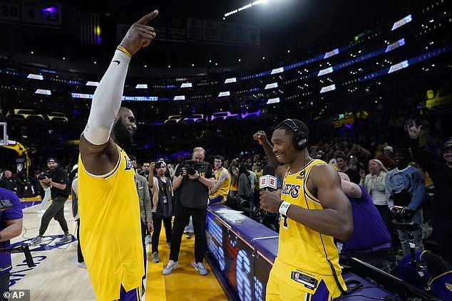 LeBron James celebrates with Lonnie Walker IV after the guard's fantastic fourth quarter