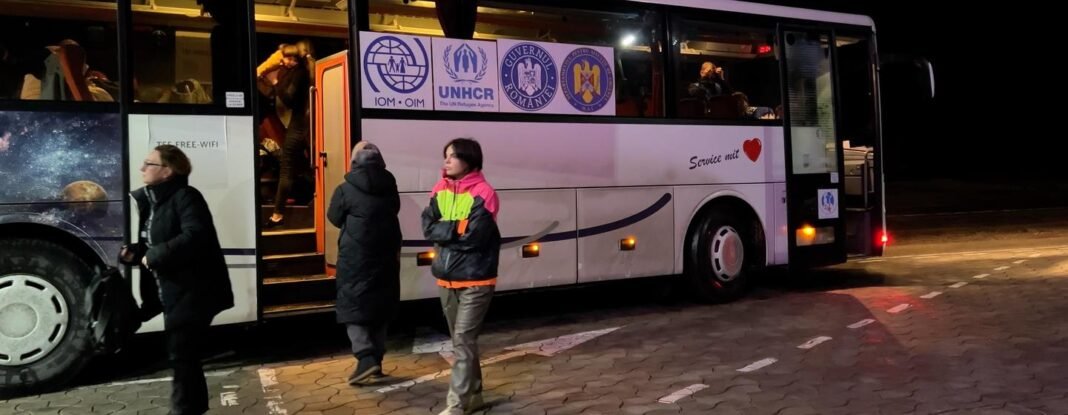 A UN-run bus takes Ukrainian refugees from Moldova to Romania.