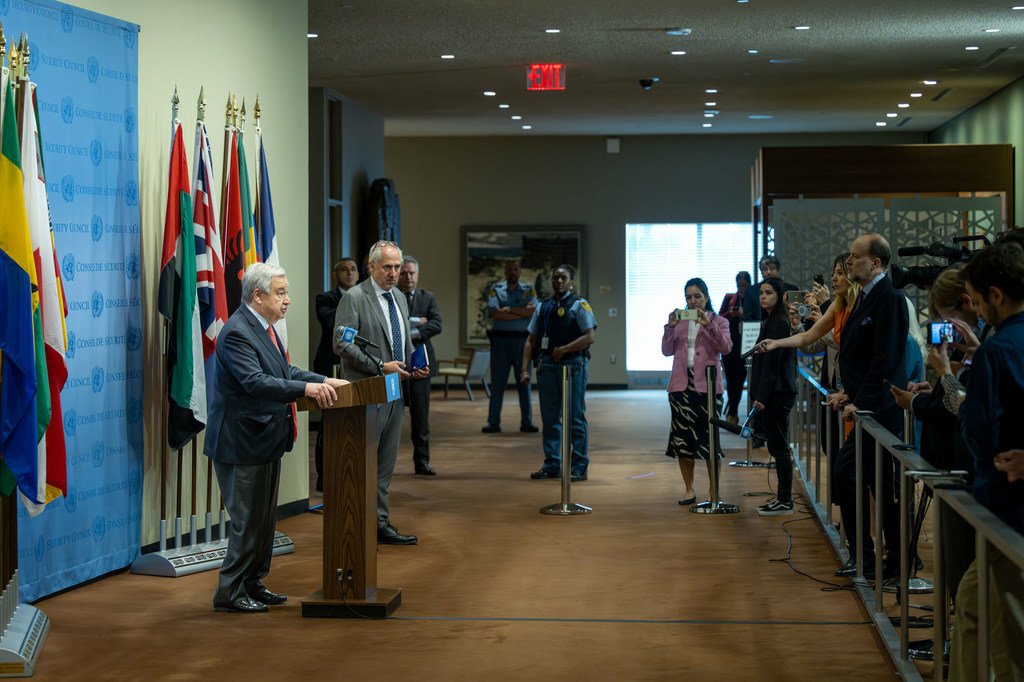 Secretary-General António Guterres (at podium) briefs reporters about the destruction in the Kakhovka hydroelectric power plant dam in Ukraine.