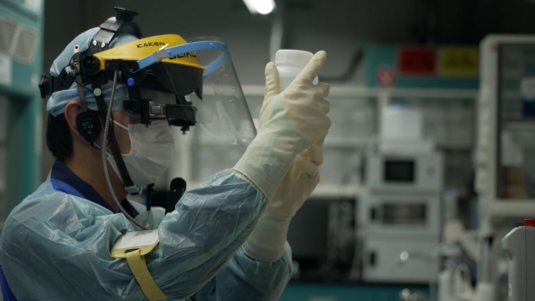 A TEPCO researcher assesses the radiation impact of treated wastewater in  Fukushima, Japan, on April 12, 2023.