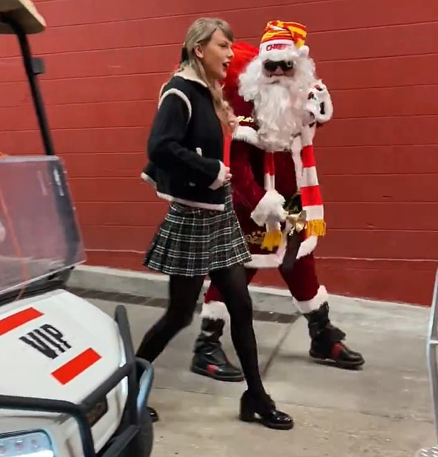 Taylor Swift is driven into Arrowhead Stadium on a golf cart with SANTA CLAUS... after jetting in from Nashville to watch boyfriend Travis Kelce as Chiefs take on the Raiders