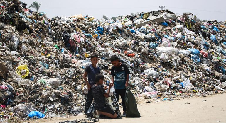 Children search a waste dump in Rafah in the southern Gaza Strip.