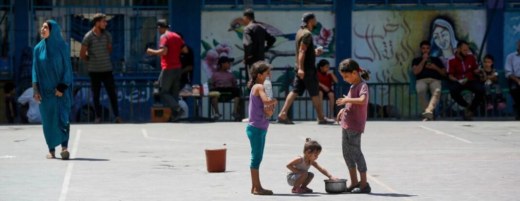 Children in Gaza play in a school converted into a shelter for families displaced by the conflict.